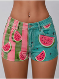 Women's low-rise, slim-fit denim shorts with watermelon print.